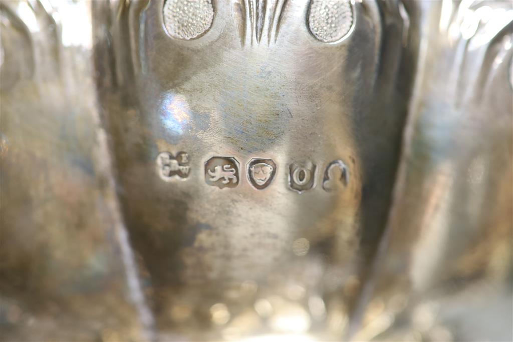 A George IV silver squat melon shaped teapot, embossed with flowers, The Barnards, London, 1829, gross 28oz.